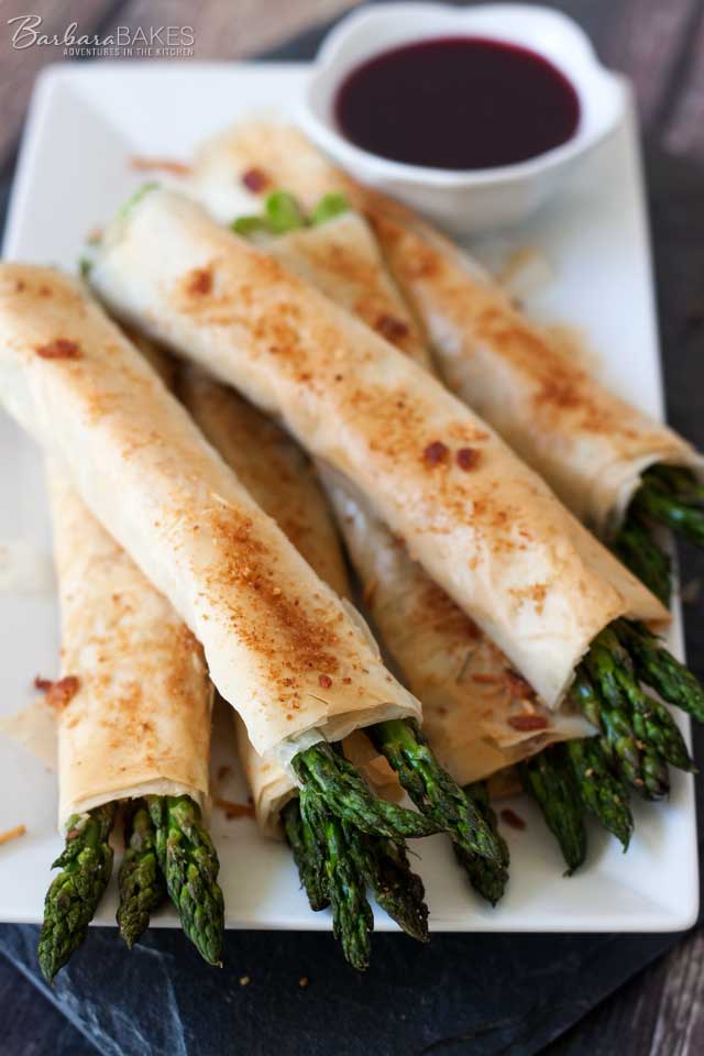 A plate of Easy to Make Phyllo, Parmesan, Bacon Asparagus Bundles