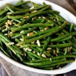 Roasted Green Beans with Almonds served in a large white bowl