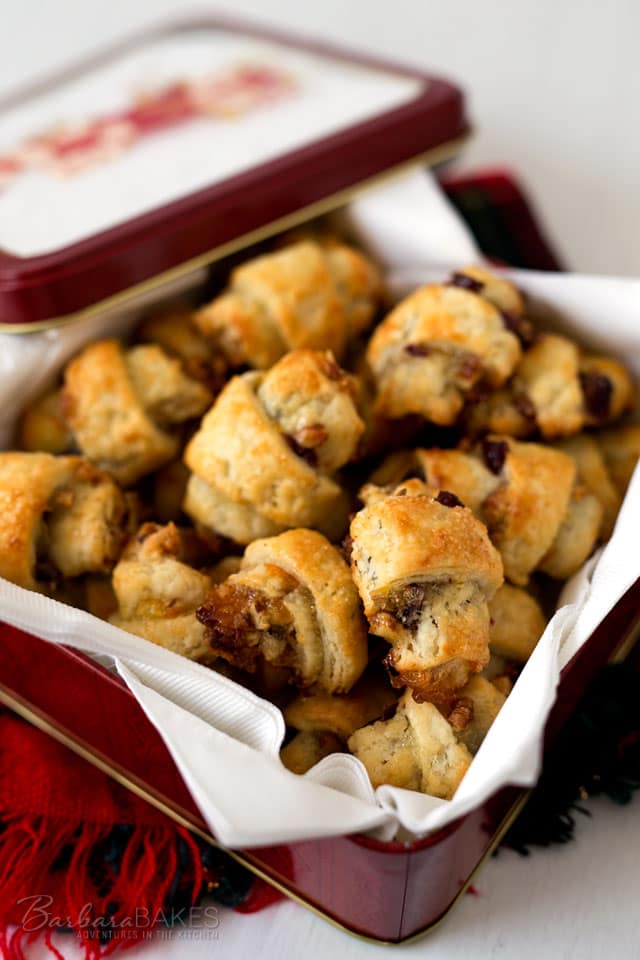 This easy-to-make Orange Cranberry Rugelach is a crisp, flaky pastry spread with orange marmalade, tart dried cranberries and chopped toasted pecans, then rolled up in a pretty crescent shape. 