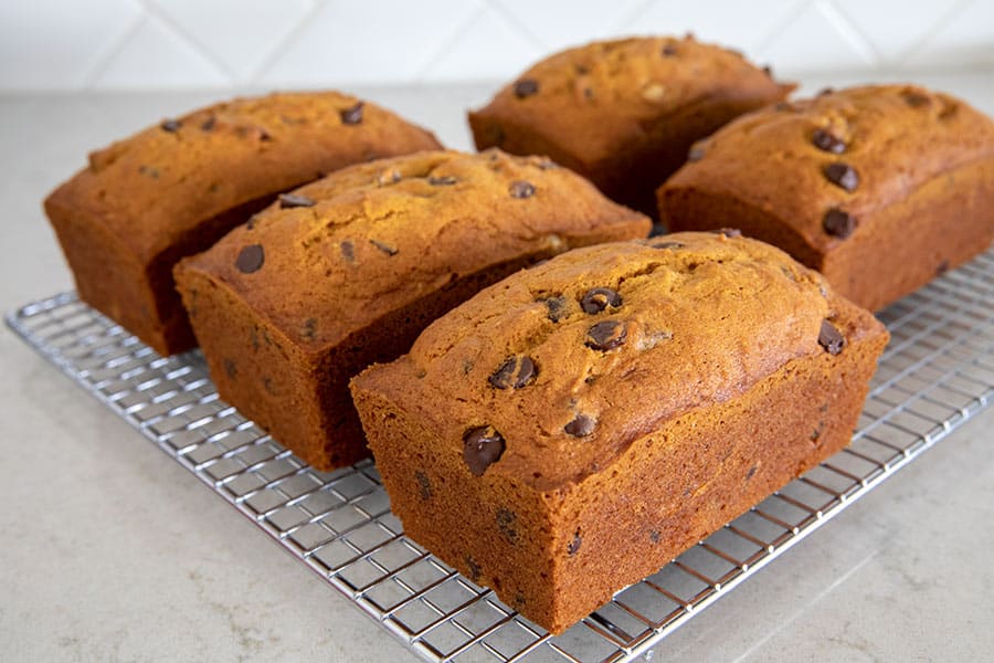 5 loaves of Pumpkin Chocolate Chip Bread on a cooling rack