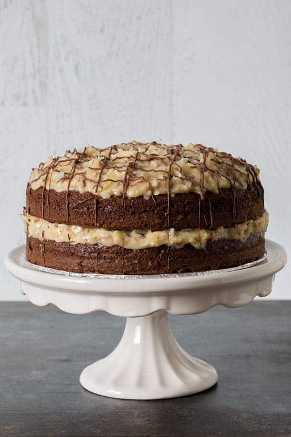 Close up of the Easy German Chocolate Cake, baked with two layers of chocolate and filled and topped with an delicious Coconut-Almond Frosting