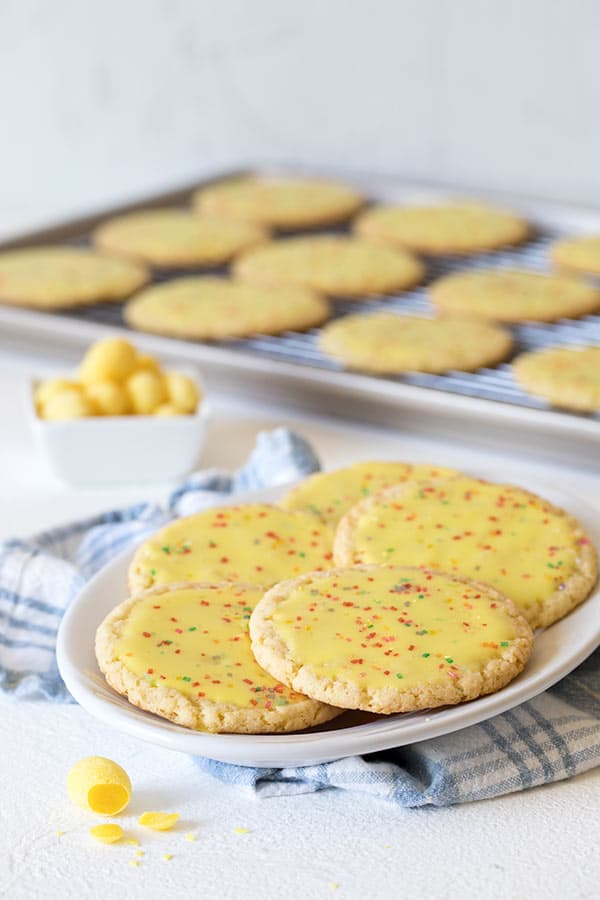 A collage of Over-The-Top-Lemon-Drop-Candy-Cookies-Plated
