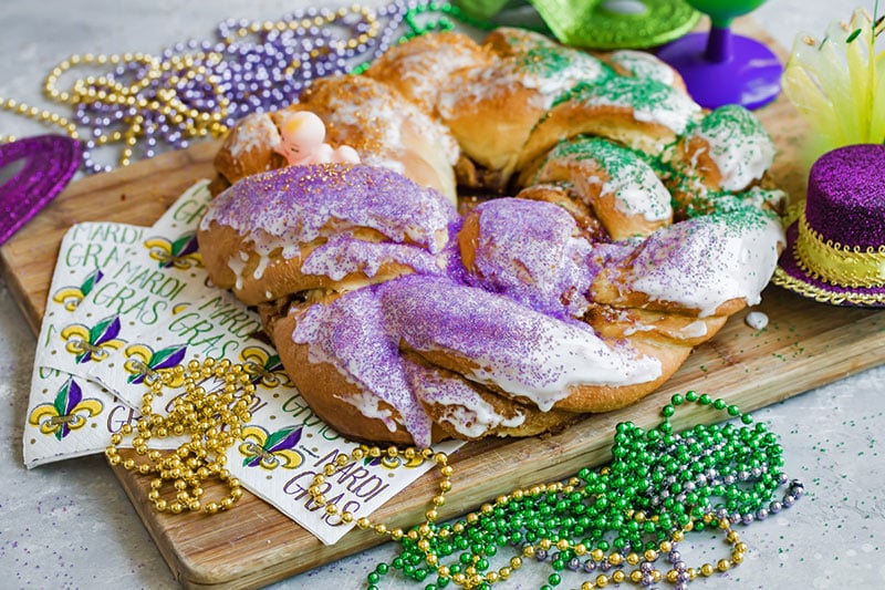Mardis Gras King Cake with beads and Mardi Gras Napkins