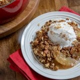 Apple Crisp on a Plate with a Scoop of Vanilla Ice Cream