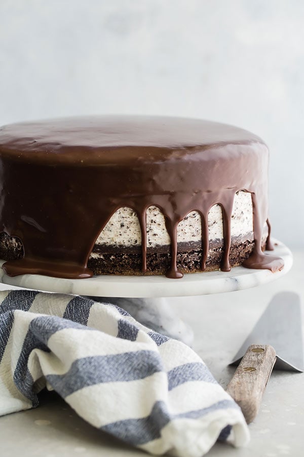 Chocolate Cake with an Oreo Cheesecake Filling on a white cake stand