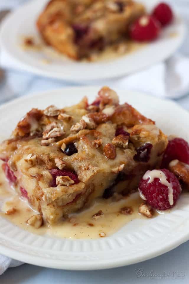 Luscious bread pudding made with a mix of croissants, thick sliced white bread, raspberries and dried cranberries, baked until it's golden brown and served warm with a smooth, rich, vanilla cream sauce.