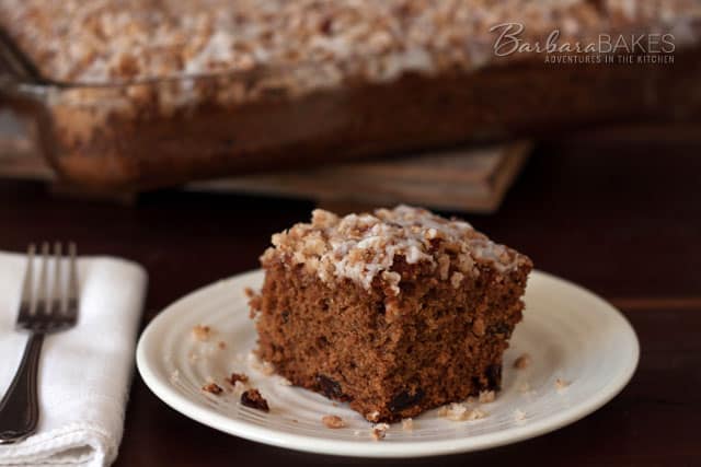Applesauce Spice Coffee Cake with a crumbly pecan topping and a sweet drizzle on top. 