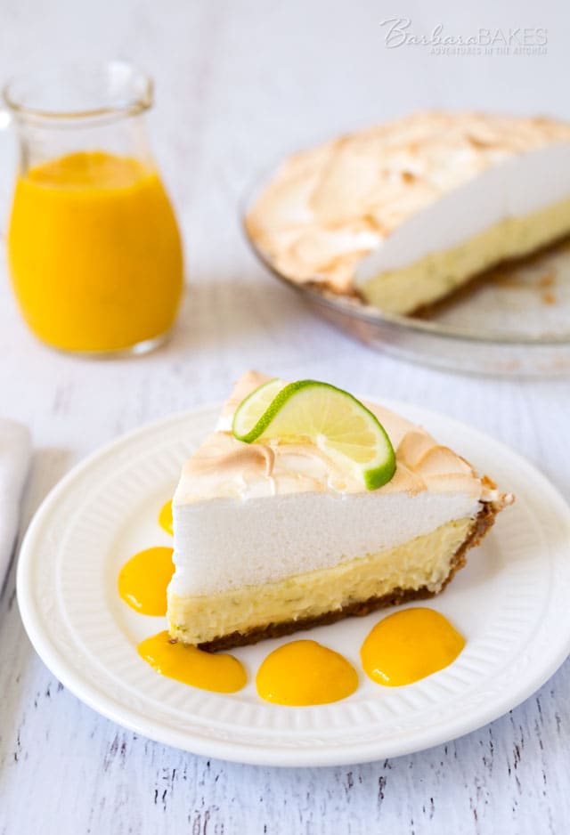 A tart, creamy key lime pie with a graham cracker crust crowned with a light as air meringue and served with a sweet mango sauce.