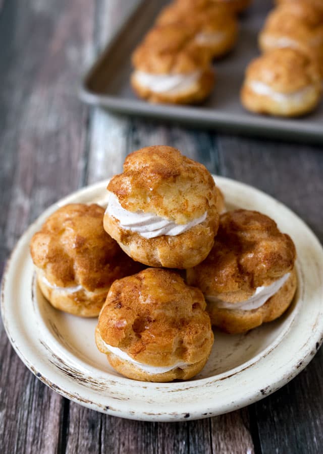 A crisp cinnamon-sugar shell filled with a light and airy cinnamon whipped cream. If you're a churro lover, you'll love these baked not fried Churro cream puffs.
