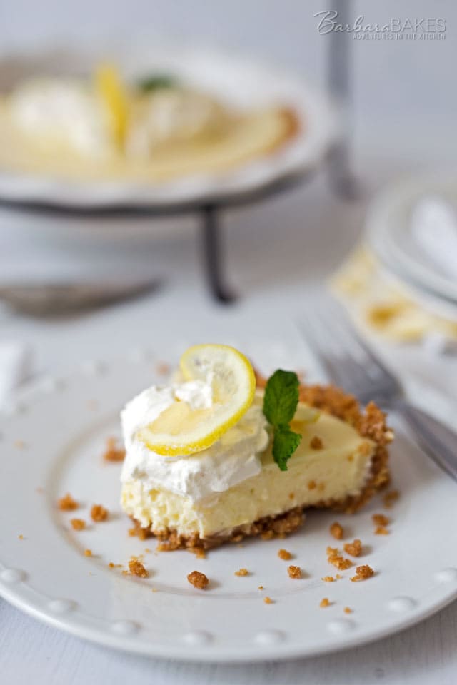 A Creamy Lemon Yogurt Pie in a crisp graham cracker crust. The easy-to-make lemon filling gets it\'s creamy texture and a little extra tang from the addition of Greek yogurt.