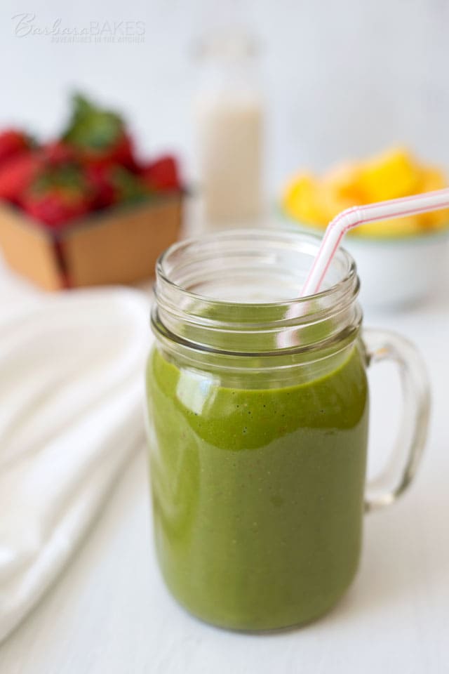 This Pink Flamango Smoothie is loaded with spinach, strawberries and frozen mango. Start your day by loading up on fruits and veggies in a Simple Green Smoothie. 