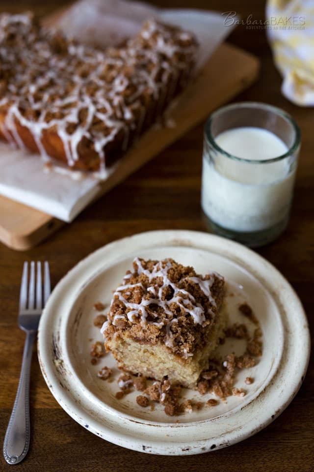 A moist buttermilk banana cake topped with a sweet, buttery crumb topping, drizzled with a simple vanilla glaze. A craveable cake your family will love. 