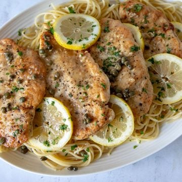 Chicken-Piccata-With-Pasta on a white platter