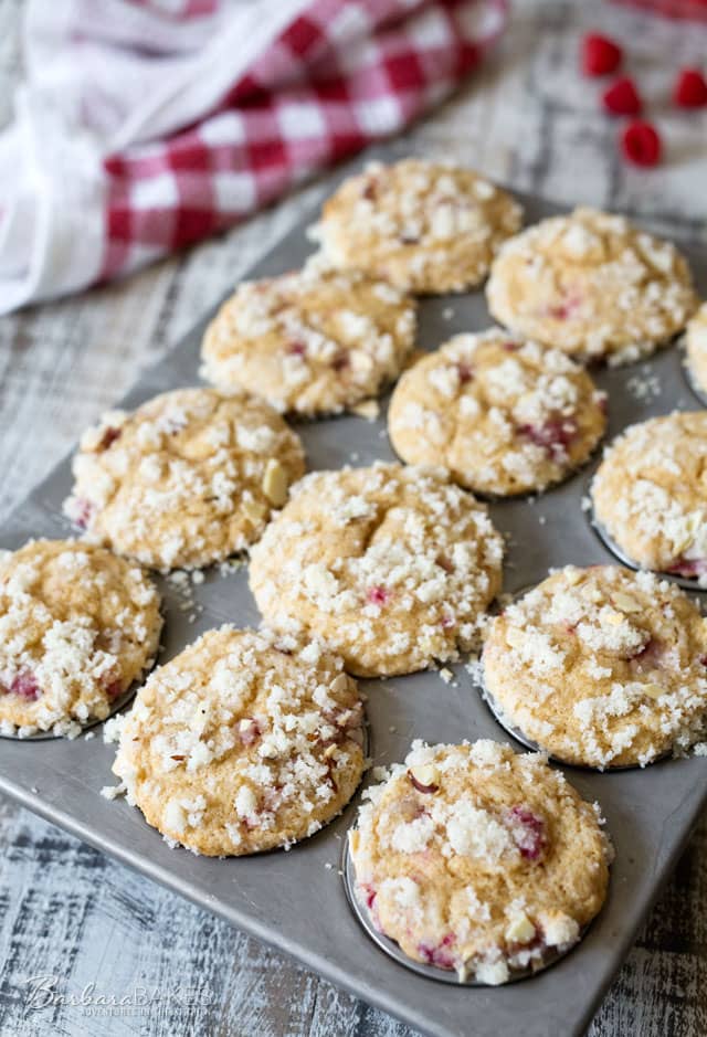 Big, fluffy, moist, tender Raspberry Banana Streusel Muffins loaded with raspberries and topped with a sweet, crunch almond streusel topping.