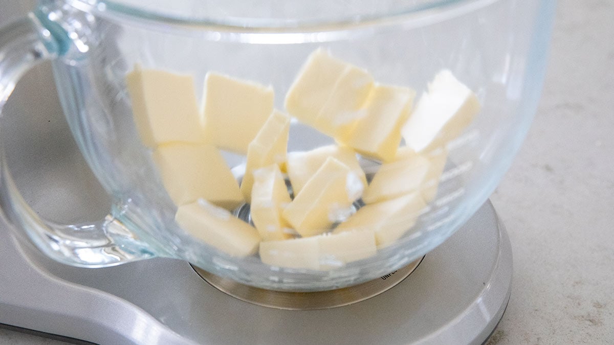 Butter cut into tablespoons in a glass mixing bowl.