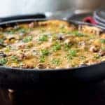 Cheesy tamale pie recipe cooked in a skillet