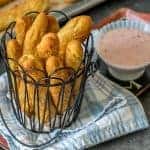 Sweet Pretzels Sticks in a wire basket with Strawberry Cream Cheese Dip