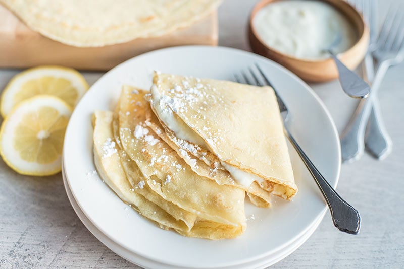 Three Crepes With Lemon Ricotta Filling on a plate