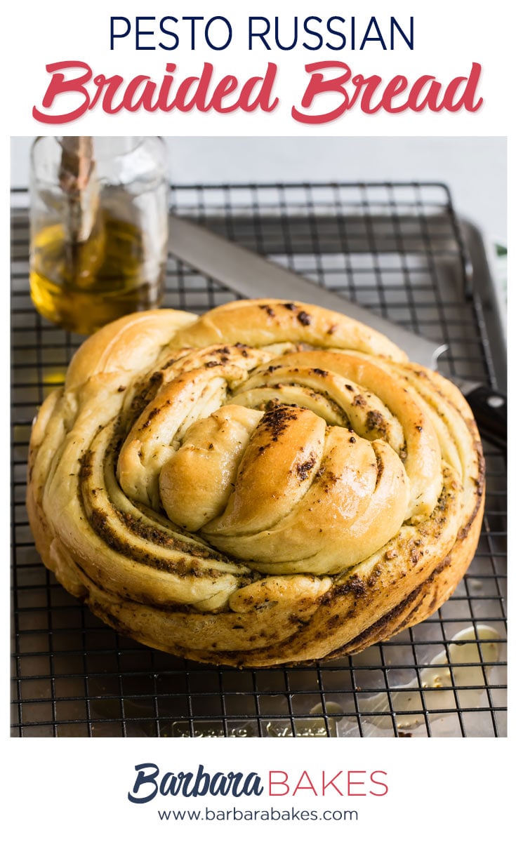 Russian Braided Bread with a sharp knife and bottle of olive oil.