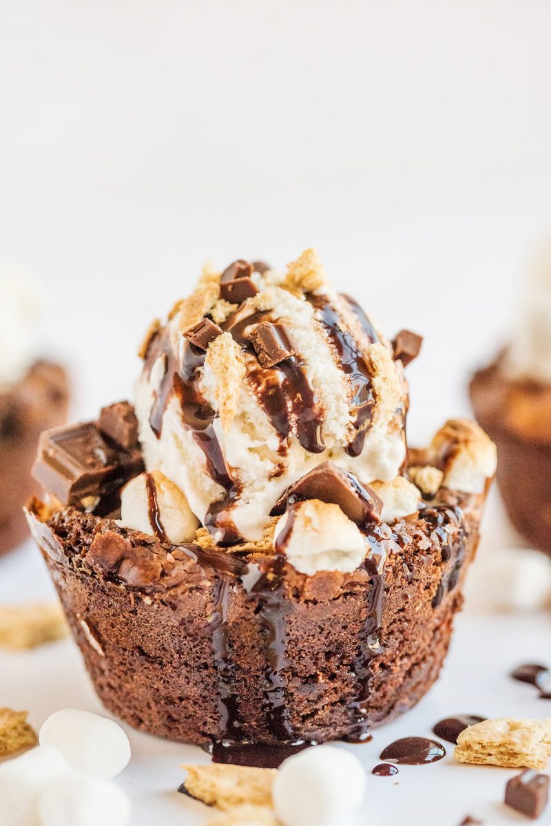 A S'mores Brookie bowl topped with vanilla ice cream and drizzled with chocolate syrup.