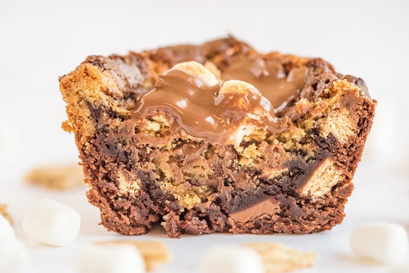 A S'mores Brookie Bowl cut in half showing the chocolate and graham cracker in the brownie batter