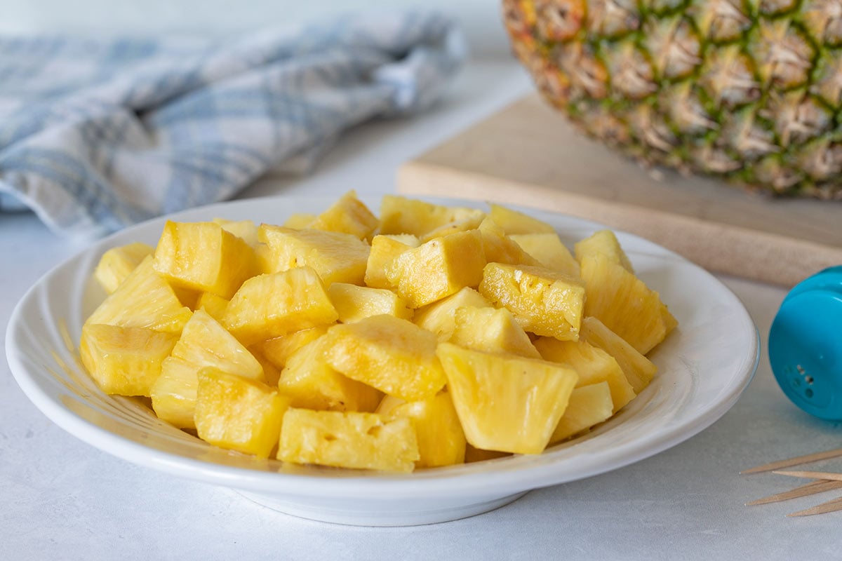 plate of pineapple cut into equal cubes