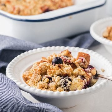 bowl of blueberry french toast bake in a small ceramic white bowl