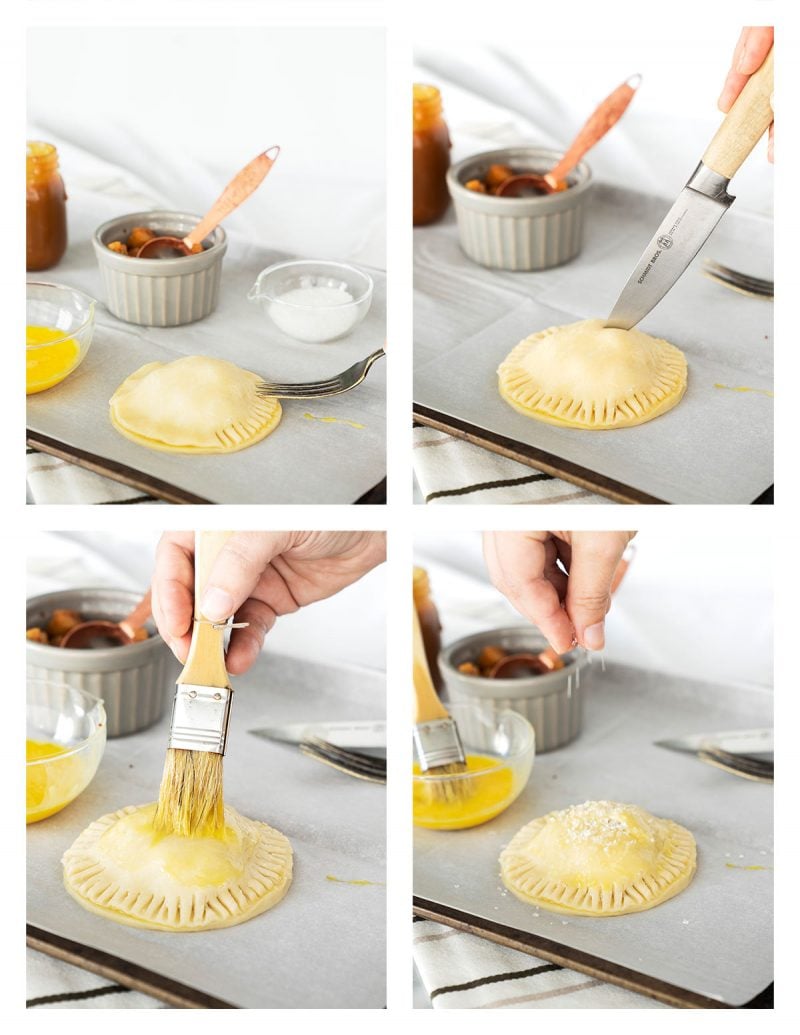 brushing apple hand pies with egg wash before baking