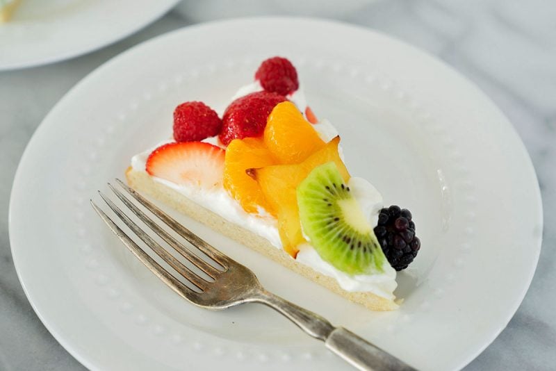 slice of fruit pizza on a white plate