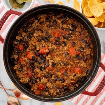 thick oven baked chili in cast iron pan