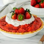 whole fresh strawberry pie with whipped cream