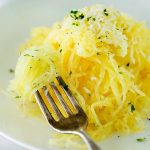 white plate with baked spaghetti squash