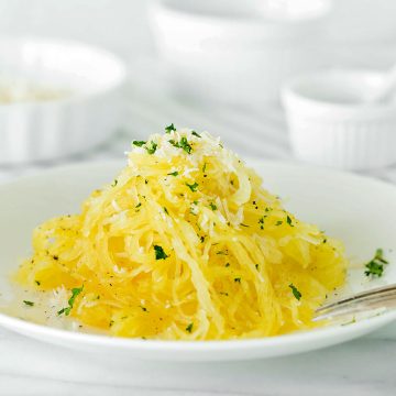 white plate of baked spaghetti squash
