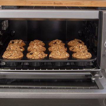 A dozen muffins baking in a Breville Smart Oven Air Fryer.