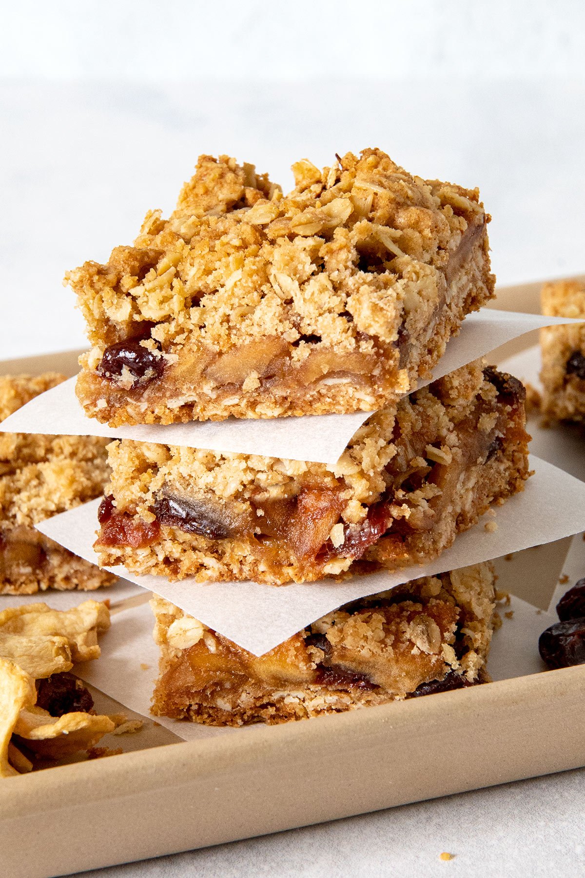 stack of apple and cherry crumble bars with oats