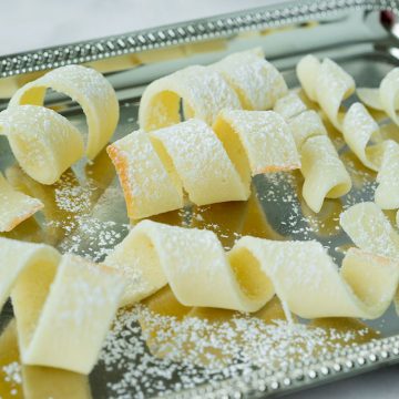 tuile cookies on a silver tray