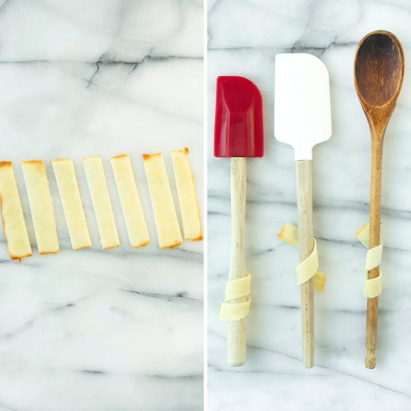 winding tuile cookies around wooden spoon handles