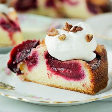 slice of plum cake with whipped cream