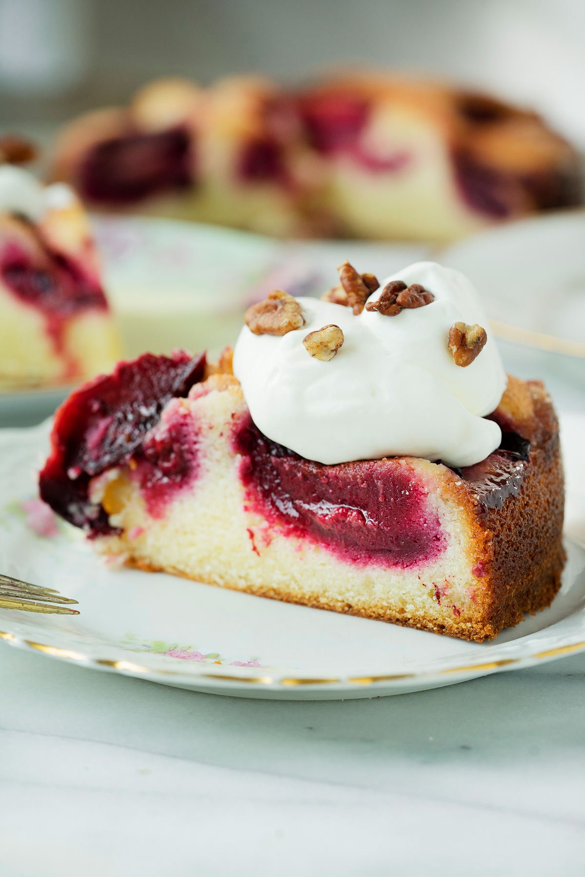 slice of plum cake with whipped cream 