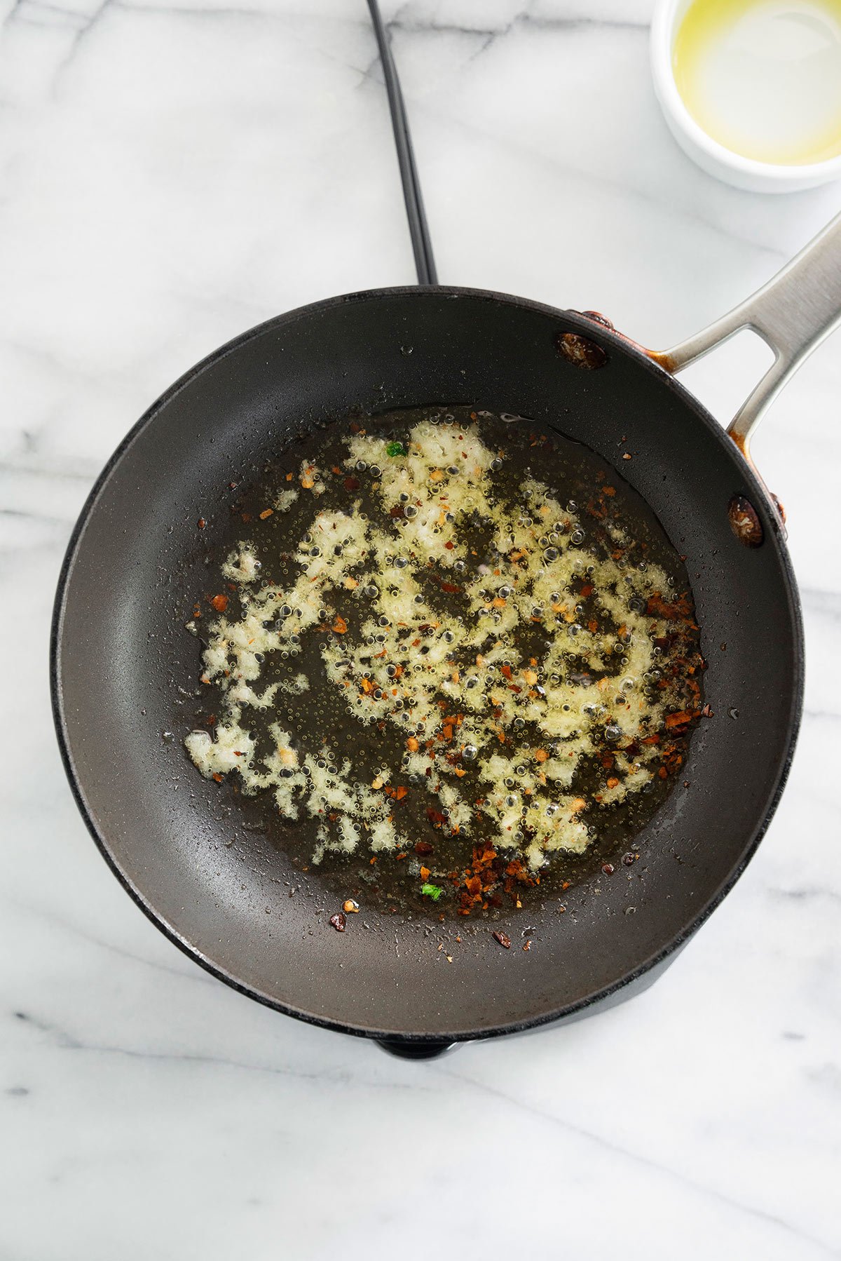 skillet with garlic olive oil sauce