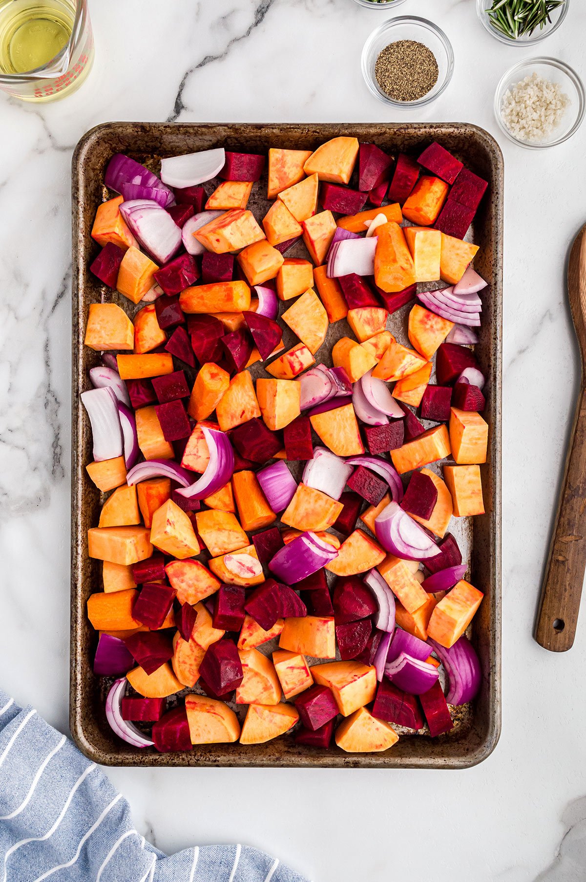 bakng sheet with cut root vegetables 