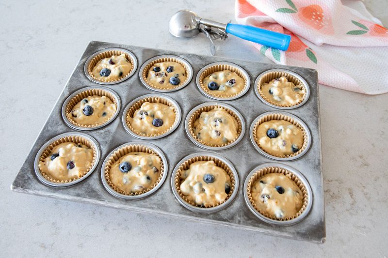 blueberry muffins in a pan before cooking