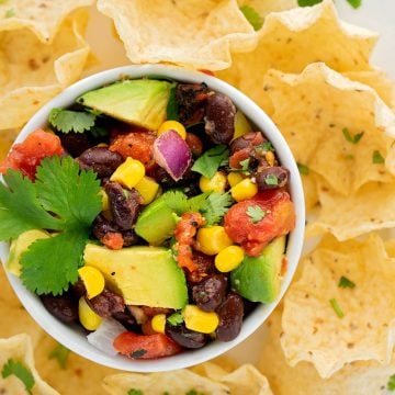 bowl of corn and black bean salsa with tortilla chips