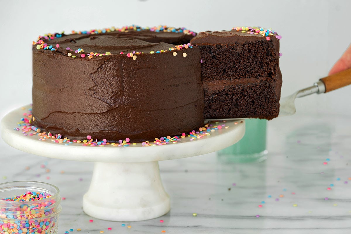 whole frosted black magic cake with sprinkles