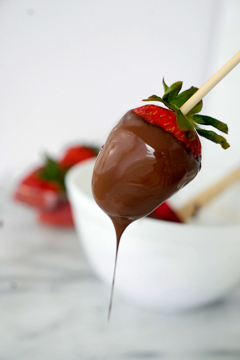 chocolate dripping from a strawberry
