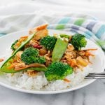 plate of chicken stir fry with peas