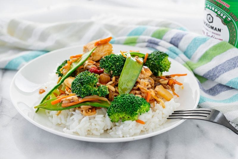 plate of chicken stir fry with peas