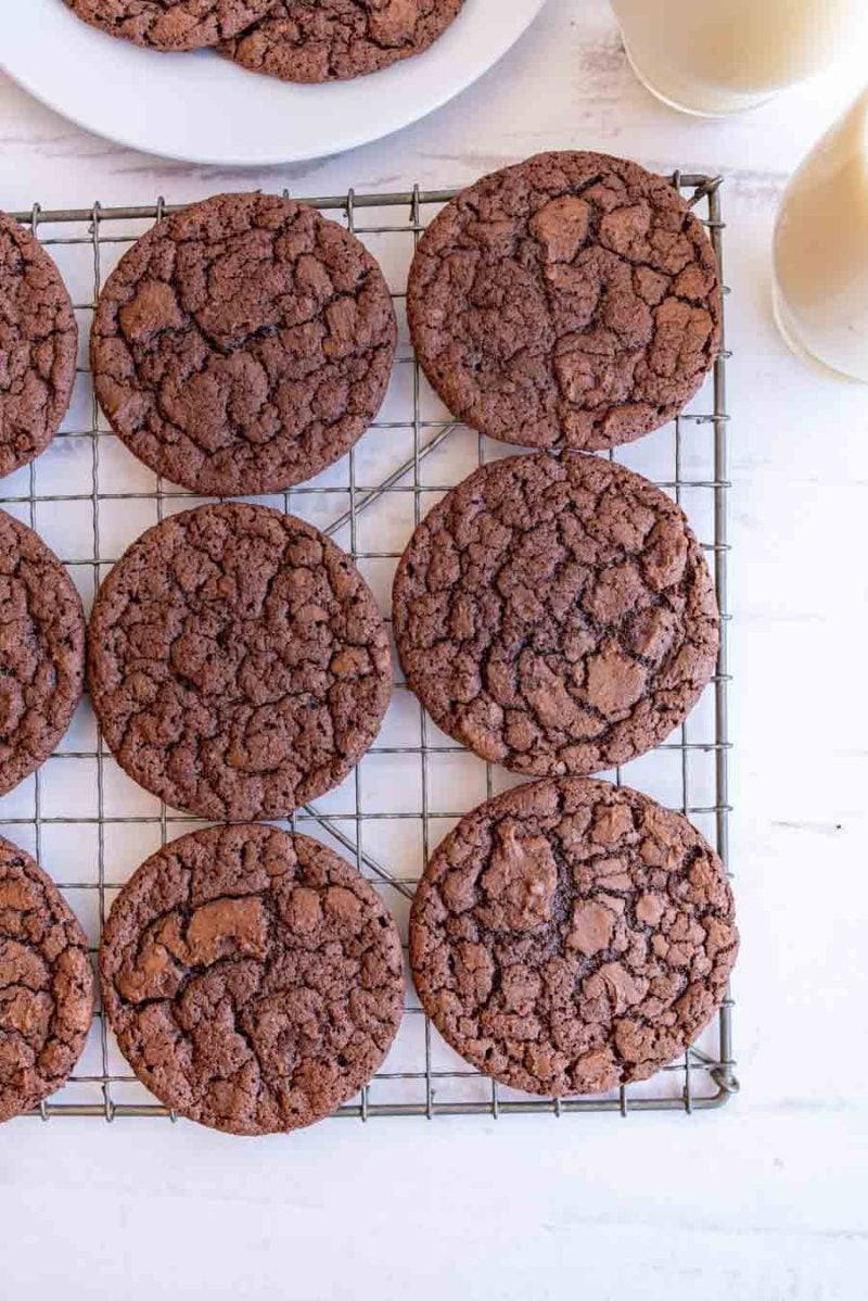 cracked and beautifully baked brownie cookies on a cooling rack
