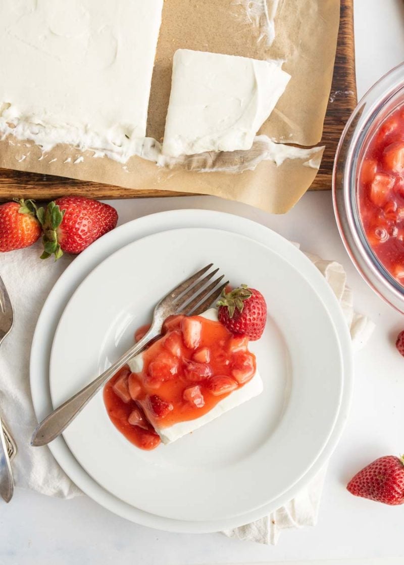 a slice of no-bake strawberry cheesecake from an overhead view