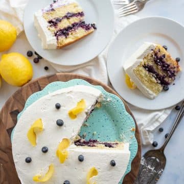 top view of the lemon blueberry cake with two pieces served onto white plates